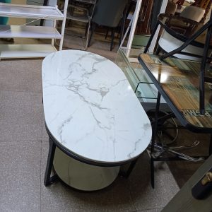 White marble coffee table with a black metal frame.