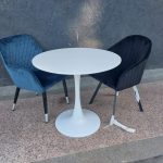 A white 2-seater patio table set.