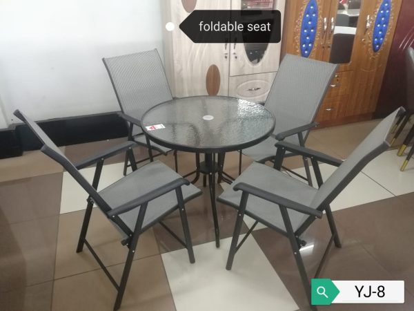 Round outdoor dining table with fold-able seats